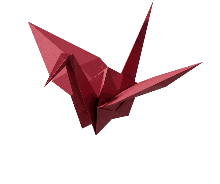 A crane folded from crimson paper, wings open, caught mid-stroke.